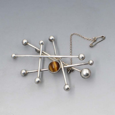 Ne From tigers eye silver atomic brooch